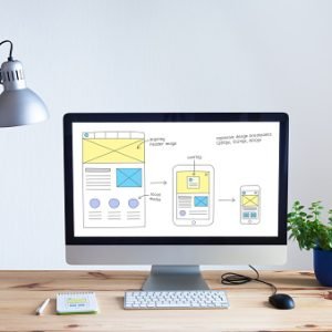 website-development1 Responsive web design website wireframe sketch layout on computer screen